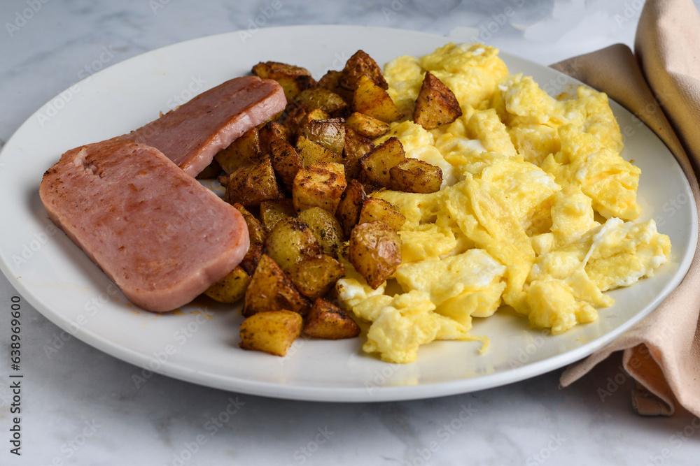 scramble eggs with homefries served with spam