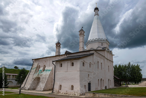 Ancient Vvedenskaya Church (1570) against a gloomy sky. Staritsky Assumption Monastery. Tver region, Russia photo