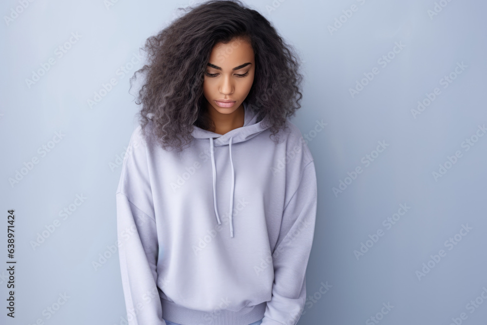 Sadness African Woman In Gray Sweatshirt On Pastel Background . Сoncept Sadness, African Women, Gray Sweatshirt, Pastel Background Sadness African Woman In Gray Sweatshirt On Pastel Background . Сoncept Sadness, African Women, Gray Sweatshirt, Pastel Background
