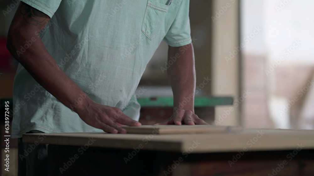 One Focused Young Black Carpenter Trimming Wood at Carpentry Workshop One Focused Young Black Carpenter Trimming Wood at Carpentry Workshop