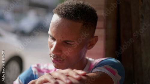 Fotografie One pensive worried young black man struggles with regret and bad conscience, victim of the circumstances