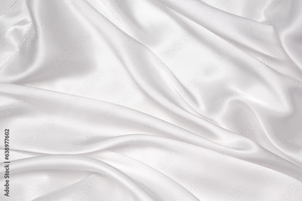 Abstract white fabric texture background. Cloth soft wave. Creases of satin, silk, and cotton.