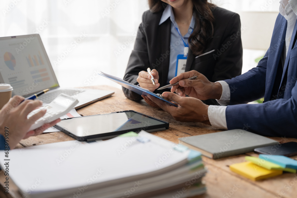 Young colleagues having great business conversations in a modern coworking office. Teamwork concept. Horizontal blurry background. Fireworks. Young colleagues having great business conversations in a modern coworking office. Teamwork concept. Horizontal blurry background. Fireworks.