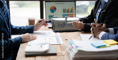 Young colleagues having great business conversations in a modern coworking office. Teamwork concept. Horizontal blurry background. Fireworks.