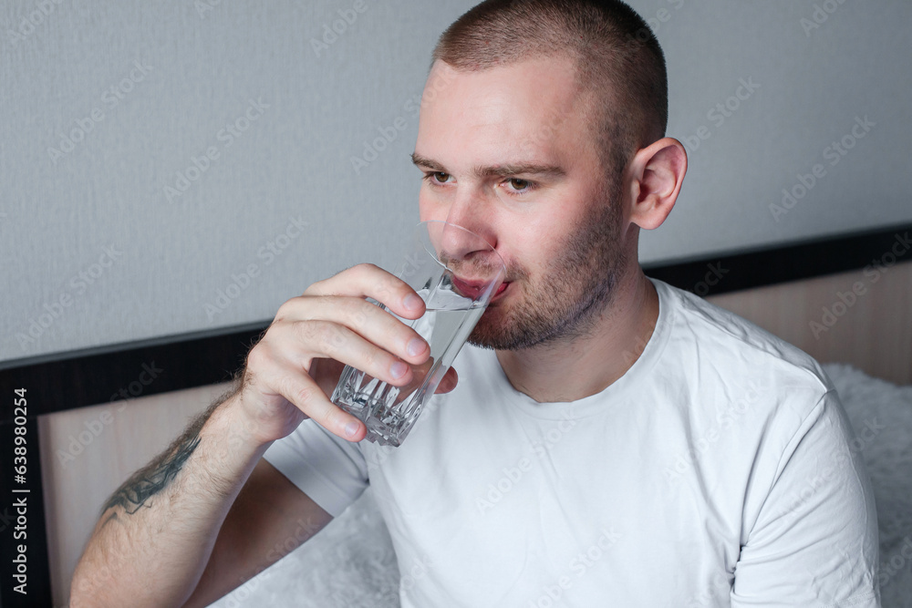 Man drinking water from a glass Man drinking water from a glass