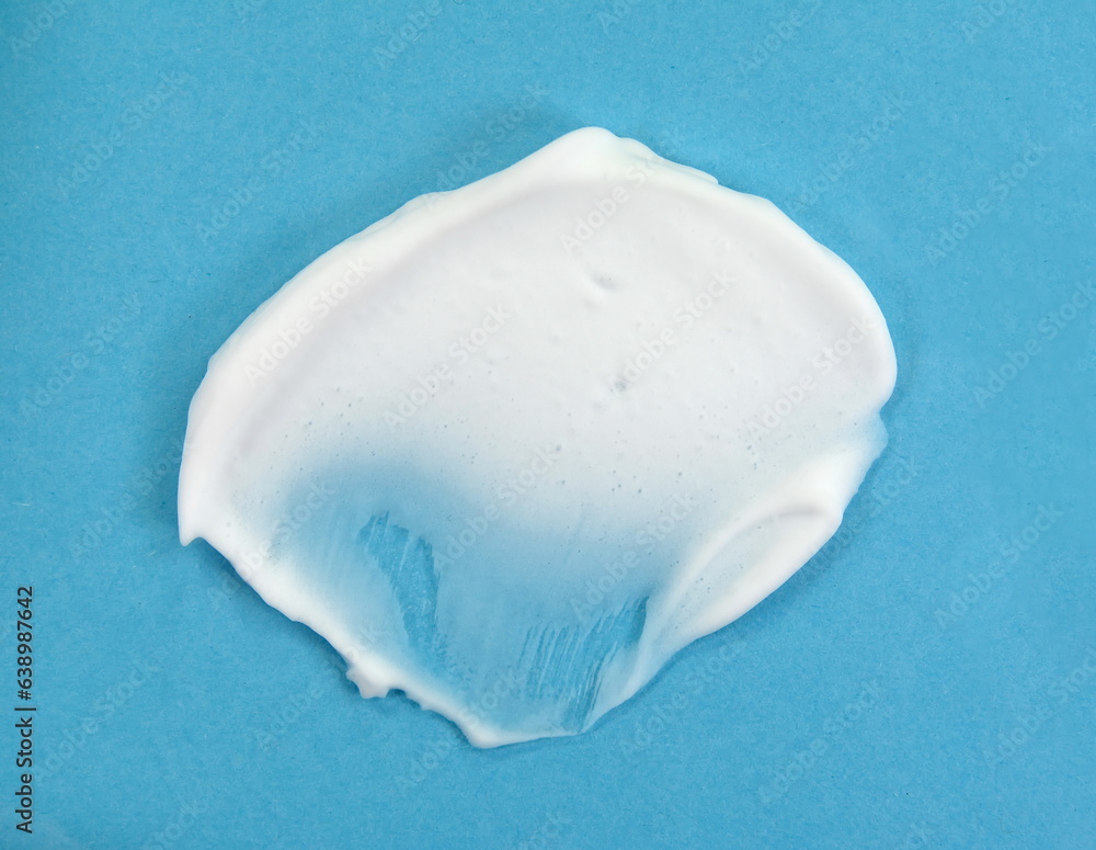 Foam bubble drop on blue background on top view object beatuy health care concept design