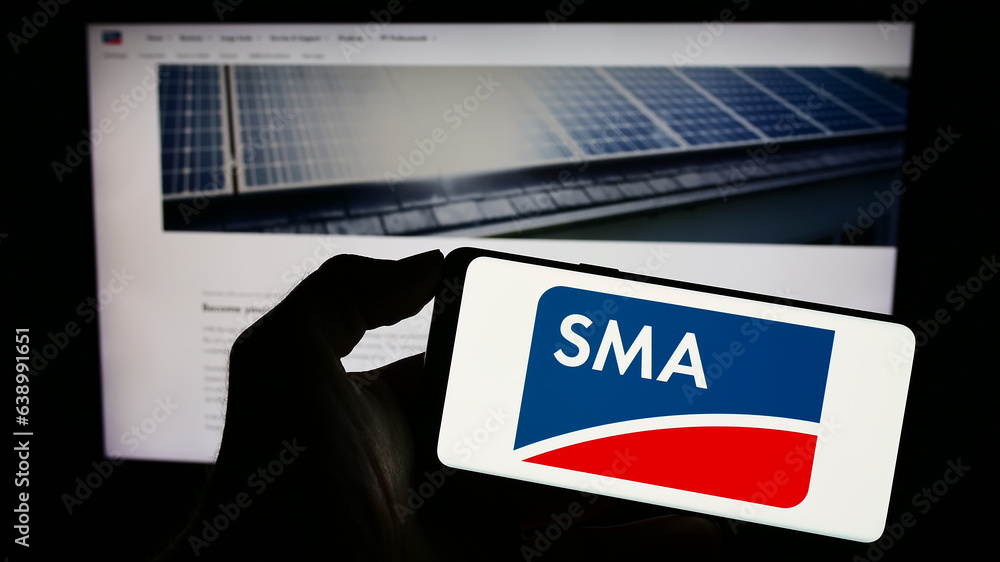 Stuttgart, Germany - 08-21-2023: Person holding smartphone with logo of