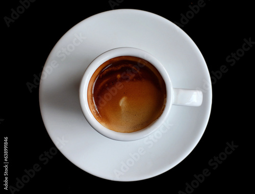 Cup of fresh made coffee served in cup on dark background. Coffee background. 