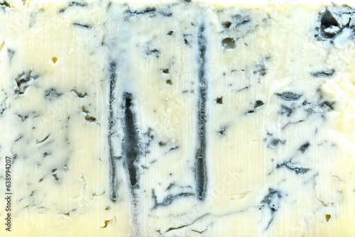 Foto Blue cheese background and texture in the cut, top view, close up, macro