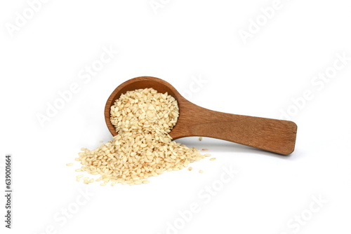 Fototapeta Naklejka Na Ścianę i Meble -  Sesame seeds in a wooden spoon isolated on white background