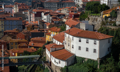 Stunning view of the Porto old town from above, red and orange tiled roofs old houses on a sunny day