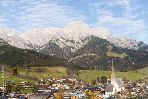 Maria Alm village below mountains in Autumn in Austrian Alps photo