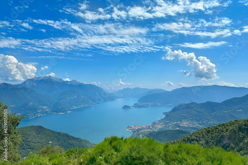 aerial view of Como Lake landscape in beautiful summer day, trees, water and mountains, Italy, Europe, concept romantic vacation by reservoir