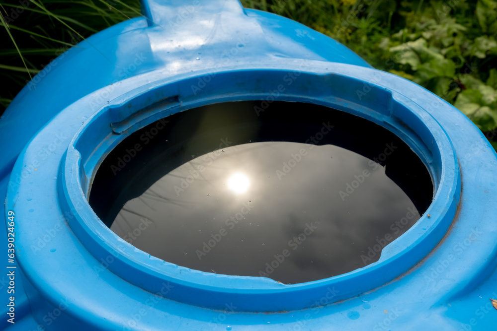 water collection tank under a roof with a drain. Rain water harvesting architecture water collection tank under a roof with a drain. Rain water harvesting architecture