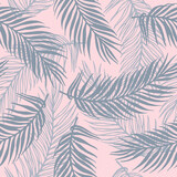 Seamless exotic palm leaves vector pattern. Floral design over waves texture