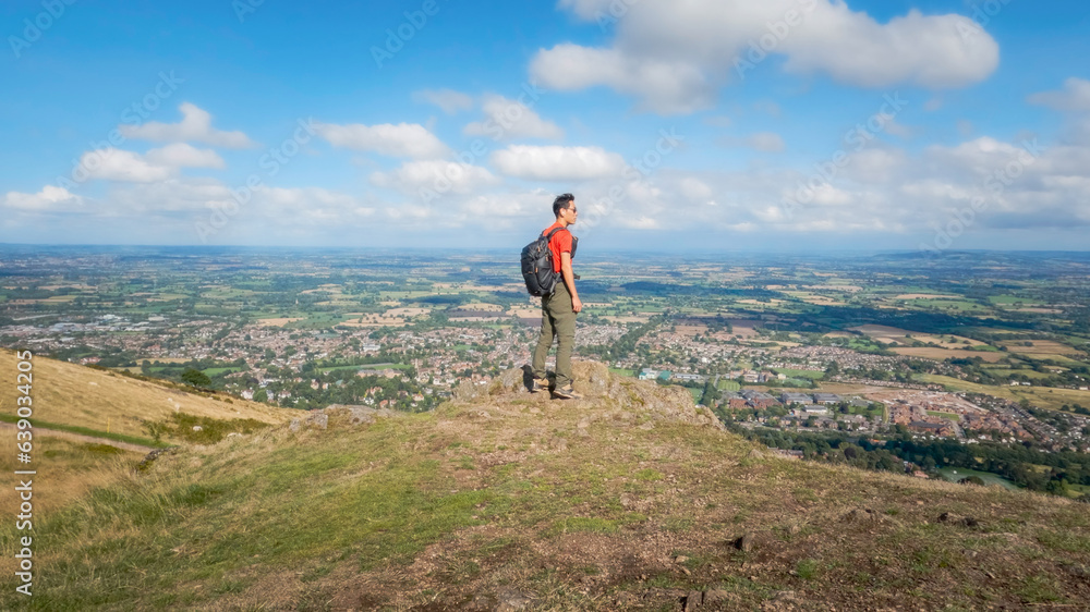 Active solo hike on the peak of Malvern Hills, Worcestershire, United Kingdom.