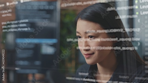 Photos Computer scientist using AR technology to visualize script, writing code on computer screen while in office using JavaScript programming language