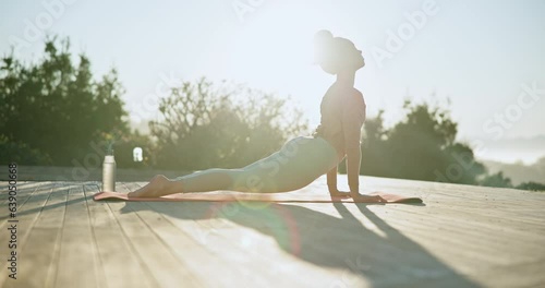 Woman, yoga and stretching body in nature, zen workout or spiritual wellness and outdoor exercise in sun. Female person or yogi in svanasana pose, relax or fitness training for mindfulness or peace photo