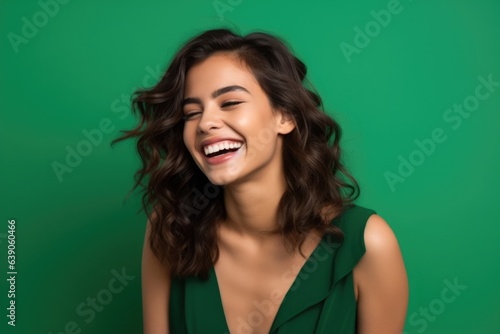 Young happy woman with brown hair - studio photo