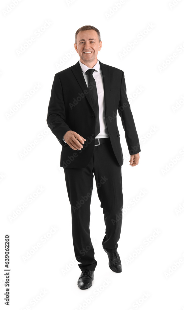 Mature businessman walking forward on white background Mature businessman walking forward on white background