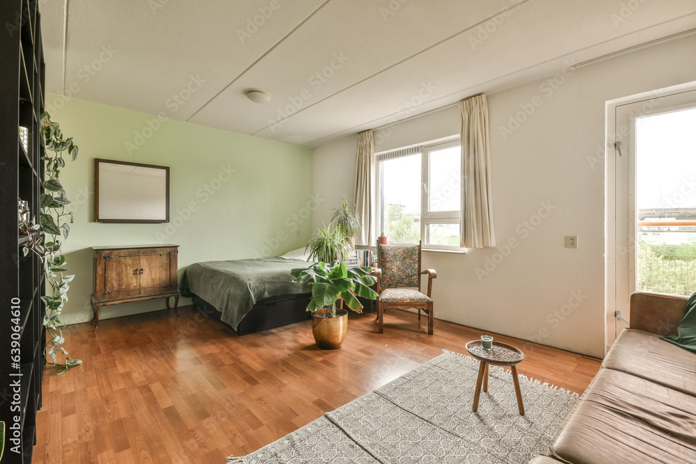 Fototapeta premium a bedroom with two beds and a table in the corner next to an open door that leads to another room