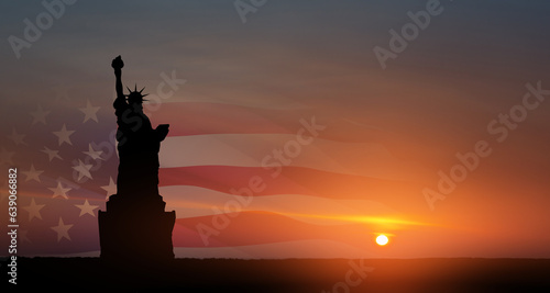 Statue of Liberty with american flag on background of sunset sky. Greeting card for Independence Day. USA celebration.