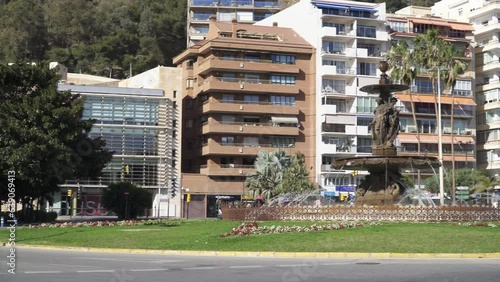 Car traffic on Plaza del General Torrijos, a sqaure and a traffic circle in central Malaga. photo