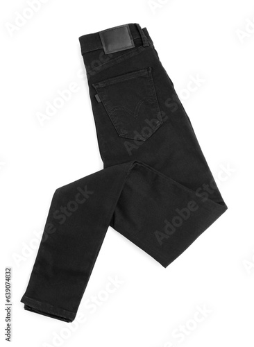 Folded black jeans isolated on white, top view