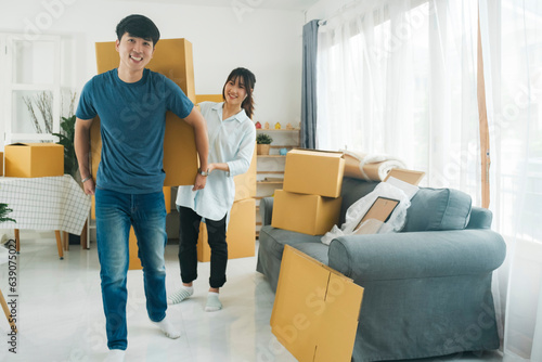 Asian young happy new married couple moving to their new house or real estate. © ijeab