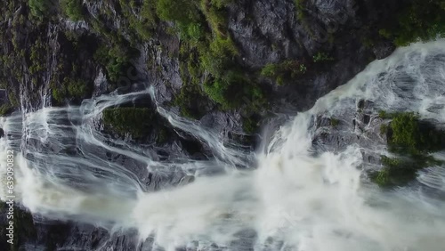 Aerial view approaching huge Colnett waterfall near Hienghene, New Caledonia. Vertical orientation photo