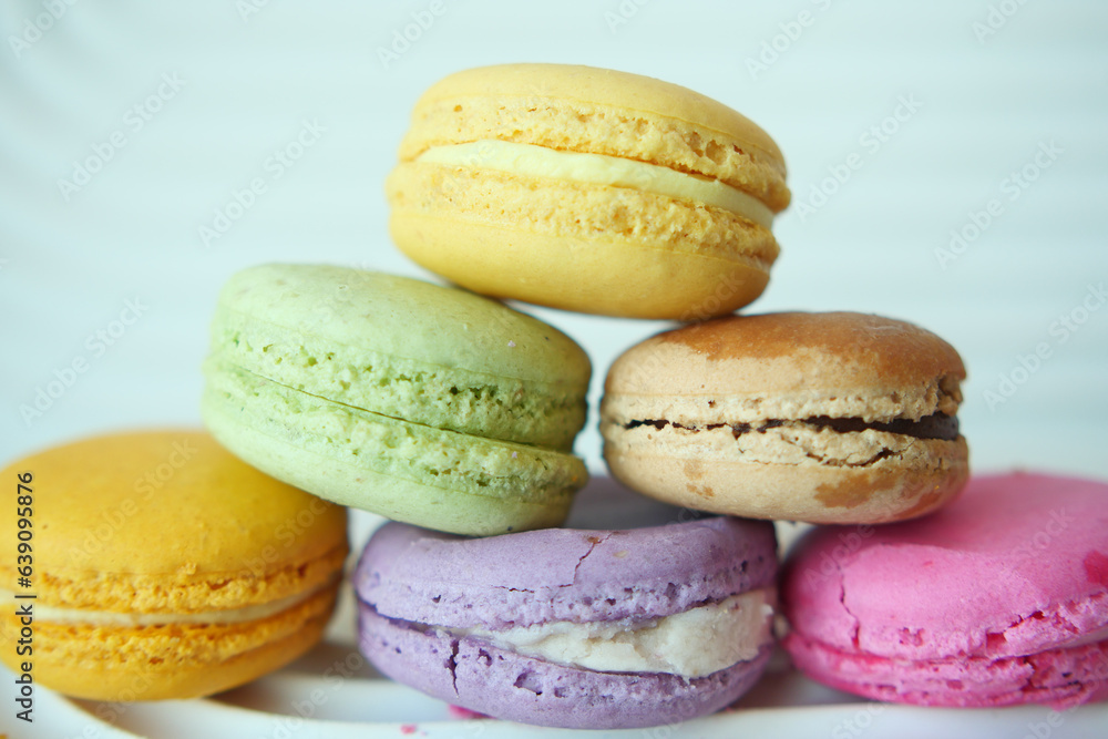 Close up of macaroon on blue background with copy space Close up of macaroon on blue background with copy space