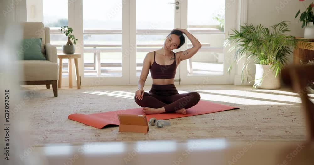 Woman, yoga and stretching in online class, fitness or zen workout on mat with tablet in living room at home. Calm female person or yogi in body warm up with technology for tutorial or pilates lesson Woman, yoga and stretching in online class, fitness or zen workout on mat with tablet in living room at home. Calm female person or yogi in body warm up with technology for tutorial or pilates lesson