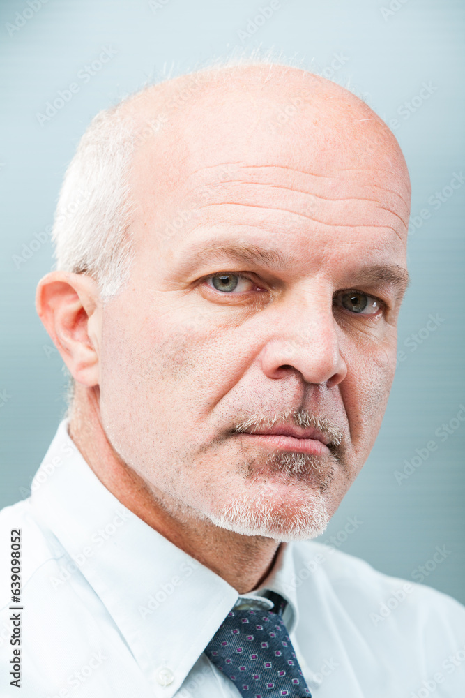Fototapeta premium Confident man, white-templed, displays integrity, expertise