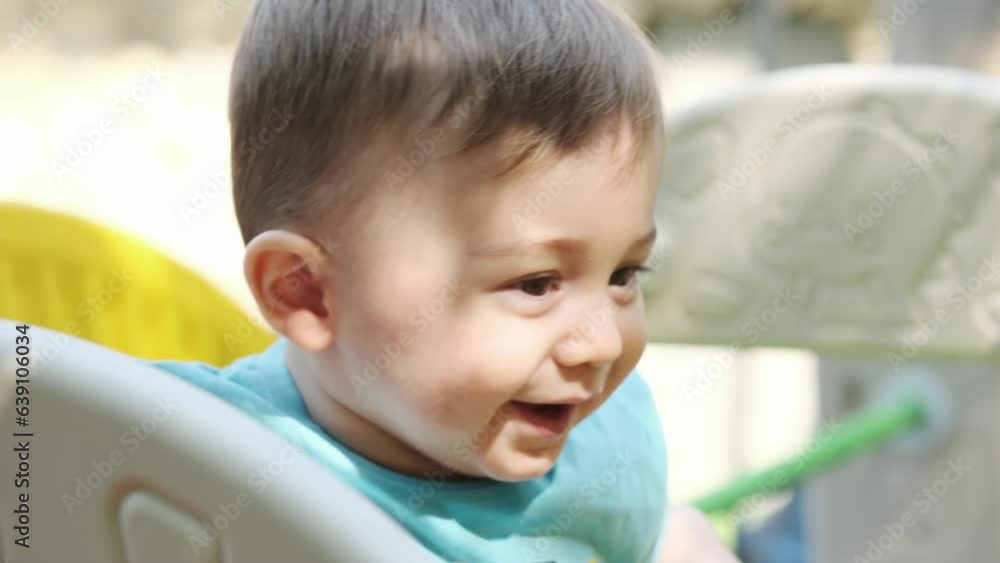 Little smiling boy playing with his mom on the playground Little smiling boy playing with his mom on the playground