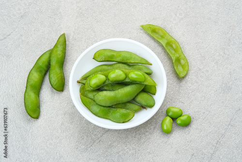 Edamame, fresh green soybeans on bamboo bowl
 photo