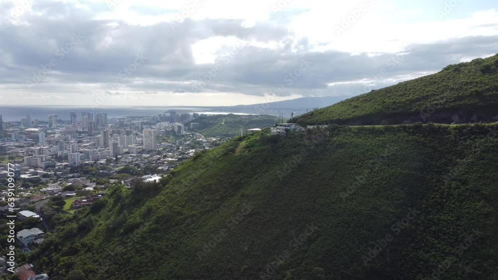 Aerial view of Honolulu in Hawaii with Mountains at distance and the sea Aerial view of Honolulu in Hawaii with Mountains at distance and the sea
