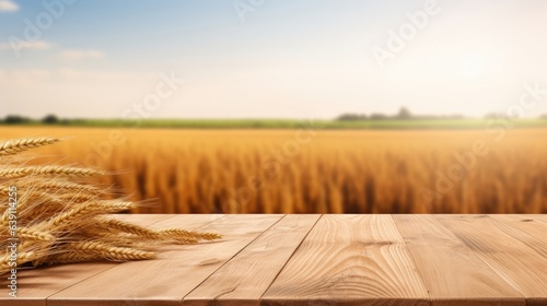 empty wooden table in modern style for product presentation with a blurred wheat field and an old barn in the background