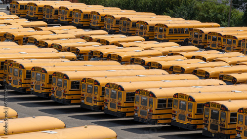 Many School buses in a parking lot. Greater Sudbury, ON, Canada, Ontario photo