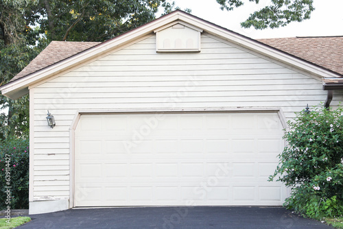 garage embodies individualism, mobility, and suburban life. It symbolizes personal space, car culture, storage, and the pursuit of the American Dream