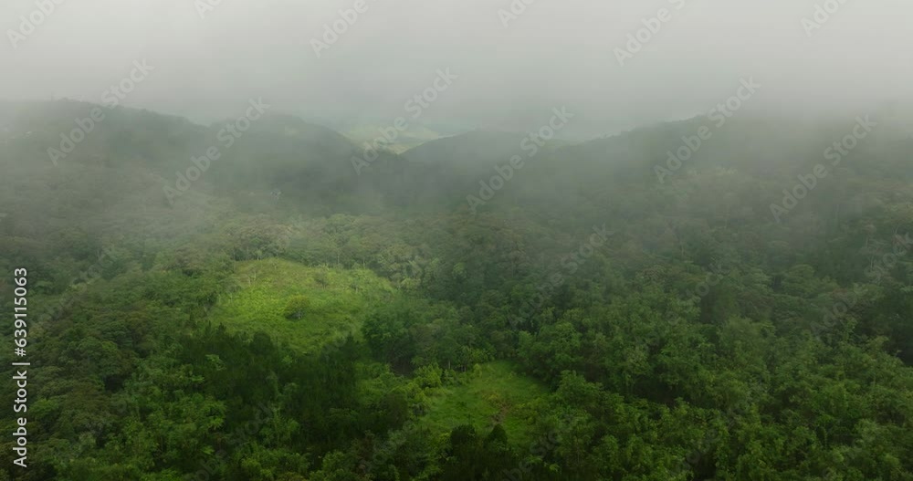Clouds and fogs over the mountain with green forest. Mindanao, Philippines. Clouds and fogs over the mountain with green forest. Mindanao, Philippines.