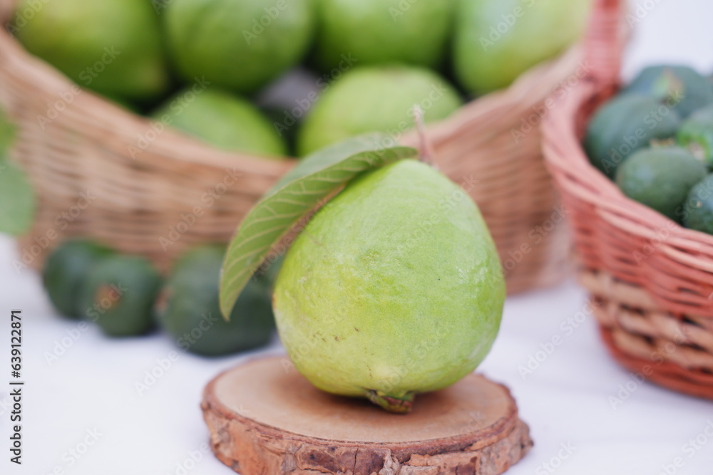 Fresh guava fruit in a basket on white background. Selective focus. Fresh guava fruit in a basket on white background. Selective focus.