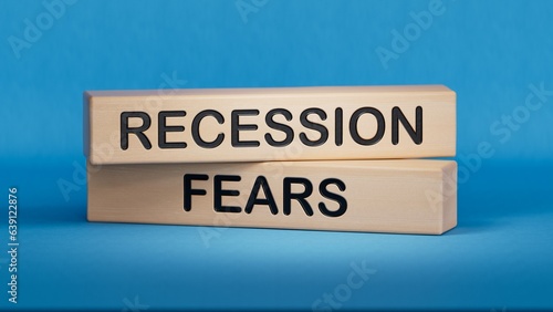 Recession fears symbol. Concept words Recession fears on wooden blocks. Business and recession fears concept. Copy space.3D rendering on blue background.
