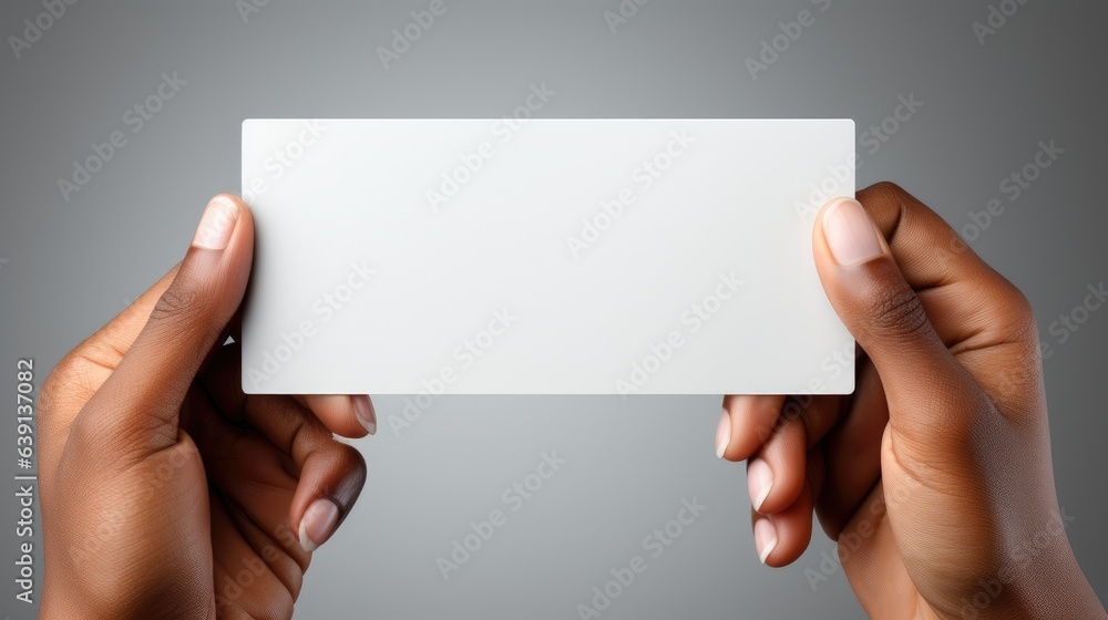 Female hands holding a blank card Female hands holding a blank card