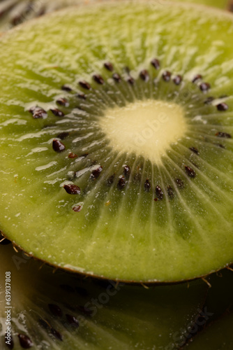 Micro close up of sliced kiwi fruit and copy space