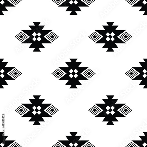 Tribal repeat pattern with Native American style. Geometric seamless ethnic pattern. Black and white colors. Design for textile, template, fabric, shirt, rug, decorative, background.