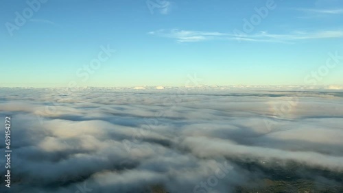 Wallpaper Mural Left side view of the halo of an airplane overflying a blanket of clouds with the afternoon warm light. Torontodigital.ca