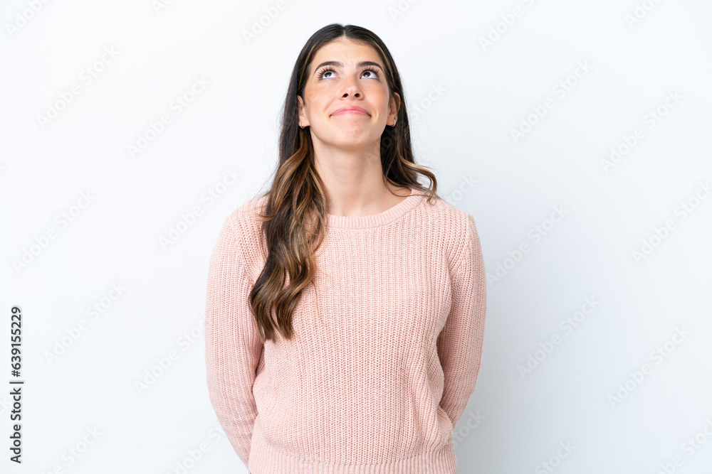 Young Italian woman isolated on white background and looking up Young Italian woman isolated on white background and looking up