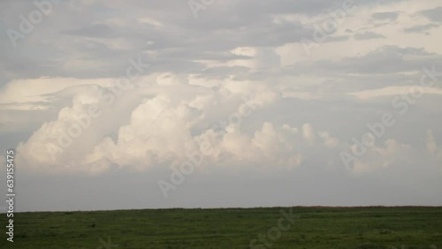 Handheld scenery landscape background of cloud cover over a field photo