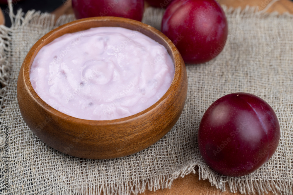 flavored pink yogurt with ripe and sweet plum