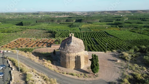 Aerial view of a chapel in a hill and a rural landscape. photo